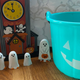 Keep allergen-free candy on hand for trick-or-treaters carrying a teal bucket.